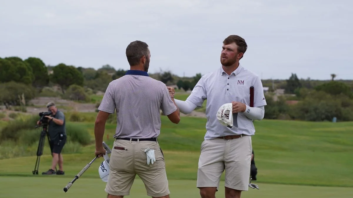 Funkhouser and Ryan Sullivan shake hands on the 18th green.